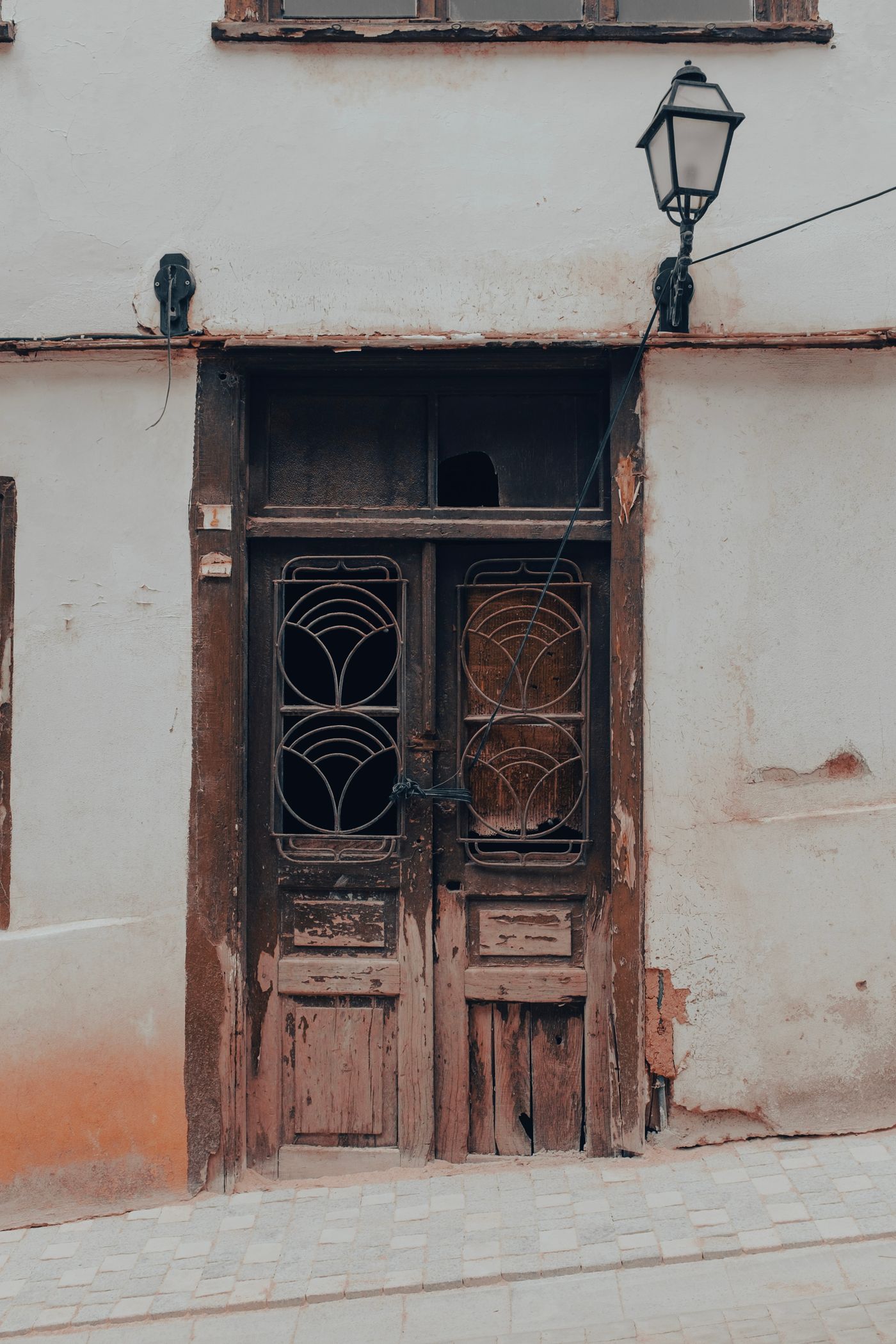 A closed weathered wooden doorway